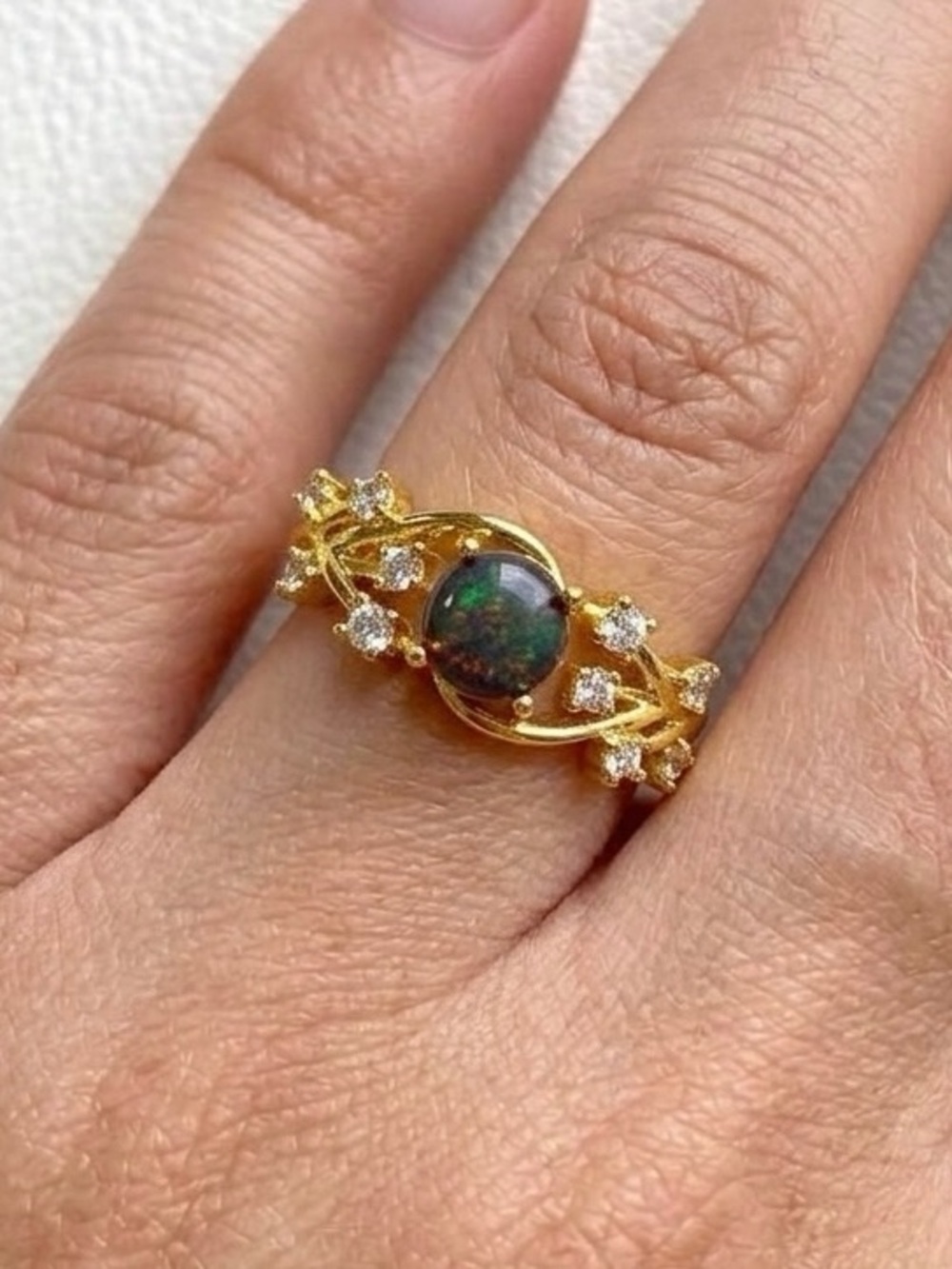 Gold plated ring with brown stone and white stones